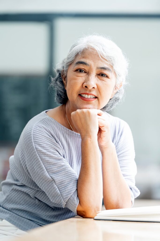 smiling middle aged mature grey haired woman